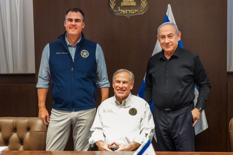 Oklahoma Gov. Kevin Stitt, left, appears with Texas Gov. Greg Abbott and Israeli Prime Minister Benjamin Netanyahu during a visit this week to Israel.