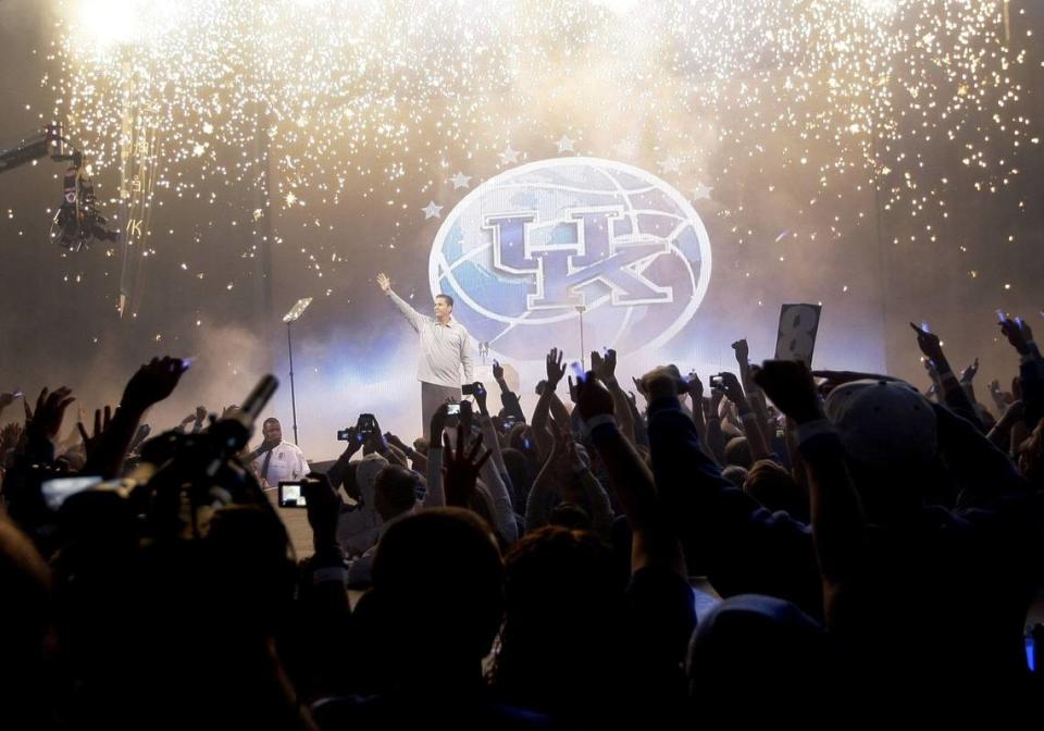 UK coach John Calipari saluted the fans as fireworks rained down at Rupp Arena during Big Blue Madness festivities on Oct. 16, 2009.