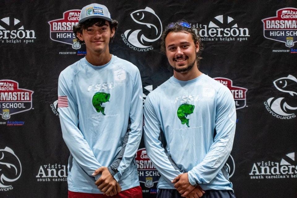 Hunter Schouest, left, and Cody Pellegrin pose Sunday, Aug. 14, 2022, after the Bassmaster High School National Championship.