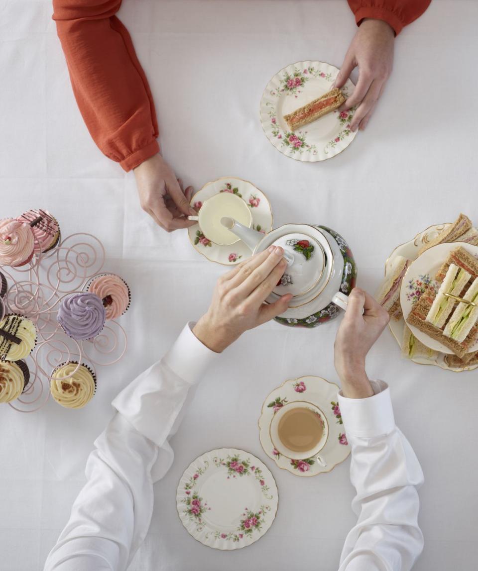 overhead view of people having tea