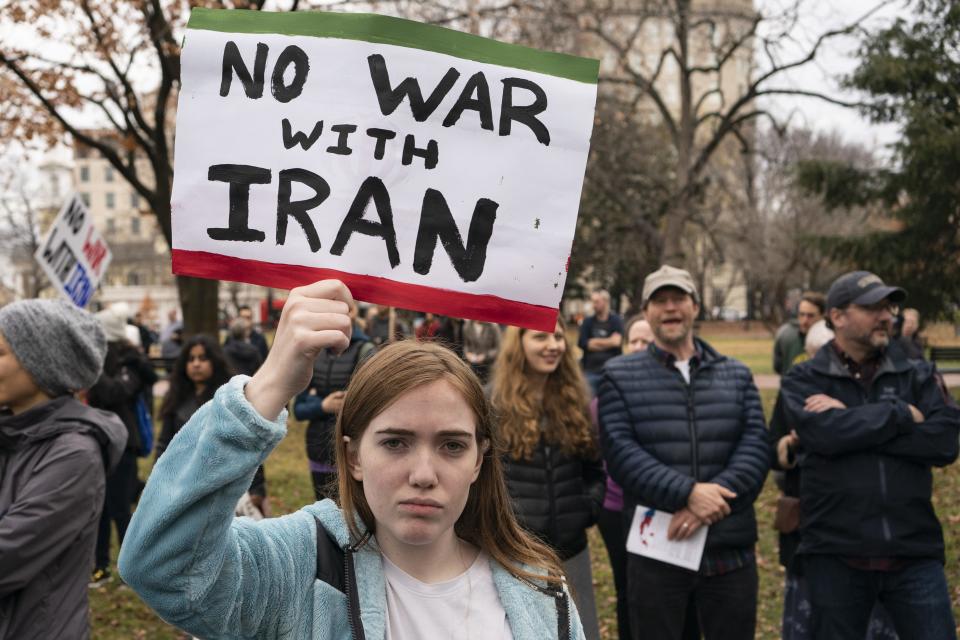 A demonstrator holds a sign during a protest against war in Iraq and Iran outside the White House on January 4, 2020 in Washington, DC. Demonstrations are taking place in several U.S. cities in response to increased tensions in the Middle East as a result of a U.S. airstrike that killed an Iranian general last week.