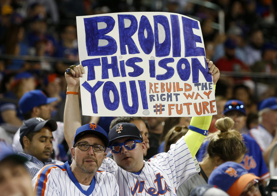 NEW YORK, NEW YORK - JUNE 30:   Fans hold a banner in reference to New York Mets general manager Brodie Van Wagenen during a game against the Atlanta Braves at Citi Field on June 30, 2019 in New York City. The Mets defeated the Braves 8-5. (Photo by Jim McIsaac/Getty Images)