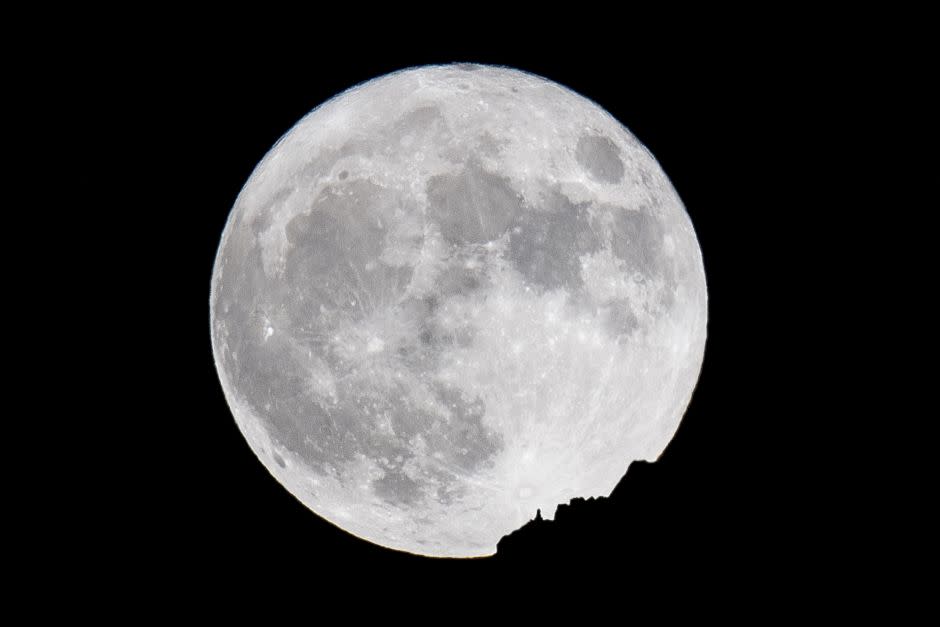 The supermoon rises behind a mountain in Arosa, Switzerland, 14 November 2016. The moon is the largest full moon since 1948 also known as the 'supermoon,' when the moon reaches its closest point to Earth. The next time the moon will be this close will be on 25 November 2034.