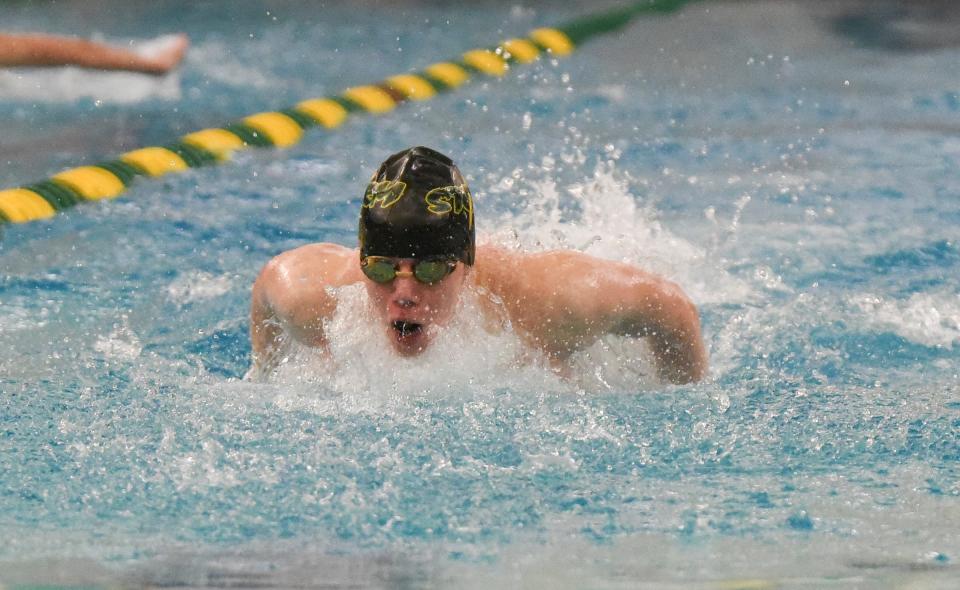 Sauk Rapids-Rice's Cash Walz swims the 100 Fly Thursday, Jan. 13, 2022, at Sauk Rapids-Rice High School.