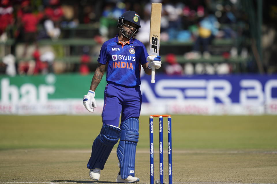 Indian batsman Shikhar Dhawan celebrates after scoring 50 runs on the first day of the One-Day International cricket match between Zimbabwe and India at Harare Sports Club in Harare, Zimbabwe, Thursday, Aug, 18, 2022. (AP Photo/Tsvangirayi Mukwazhi)