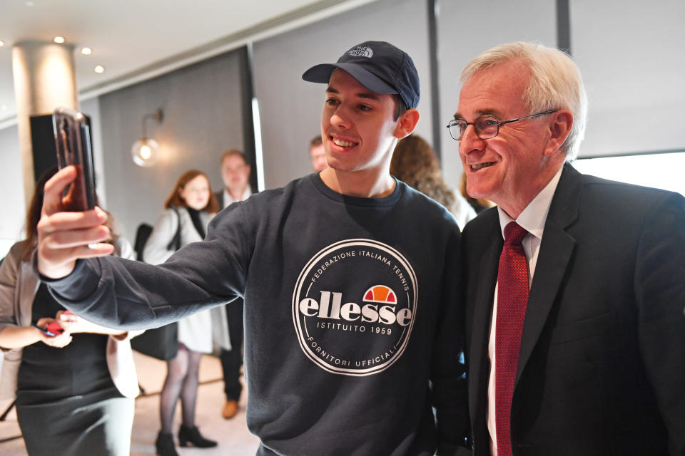 Shadow chancellor John McDonnell takes a photo with a supporter at a campaign event in Birmingham, whilst on the General Election campaign trail.