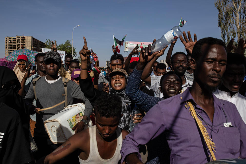 Demonstrators rally near the military headquarters in Khartoum, Sudan, Monday, April 15, 2019. The Sudanese protest movement on Monday welcomed the "positive steps" taken by the ruling military council, which held talks over the weekend with the opposition leaders and released some political prisoners. The praise came despite a brief incident earlier Monday where activists said soldiers attempted to disperse the ongoing protest sit-in outside the military headquarters in the capital, Khartoum, but eventually backed off. (AP Photo/Salih Basheer)