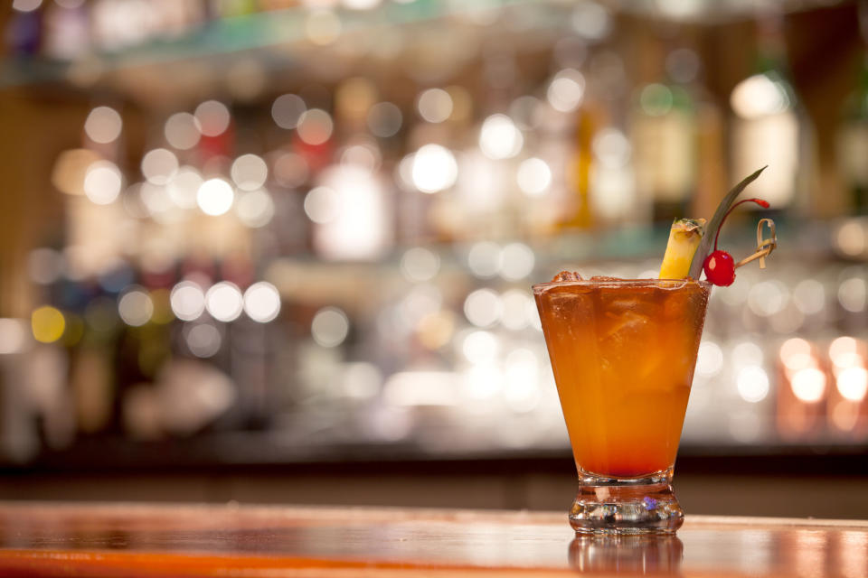 A Mai Tai drink sits on the bar