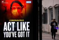 A government COVID-19 advertisement is seen amid the outbreak of the coronavirus disease in London