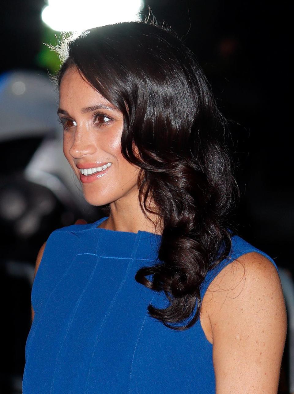 Meghan with side swept bouncy curls in 2018