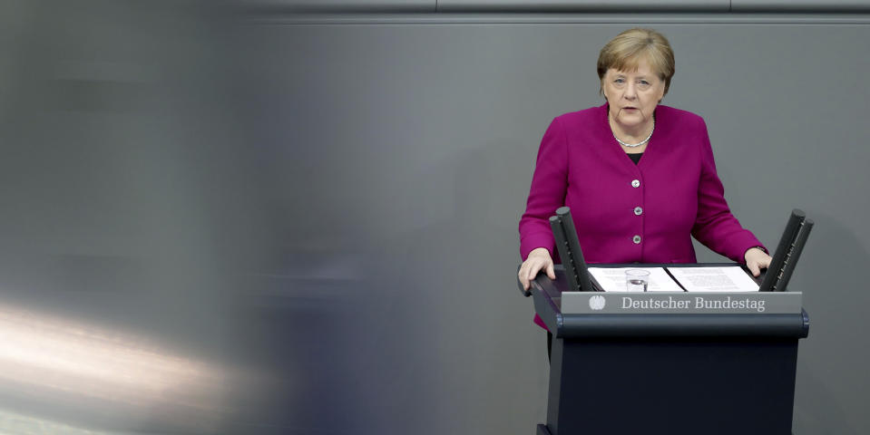 German Chancellor Angela Merkel delivers a speech during a meeting of the German federal parliament, Bundestag, at the Reichstag building in Berlin, Germany, Thursday, April 23, 2020. (AP Photo/Michael Sohn)