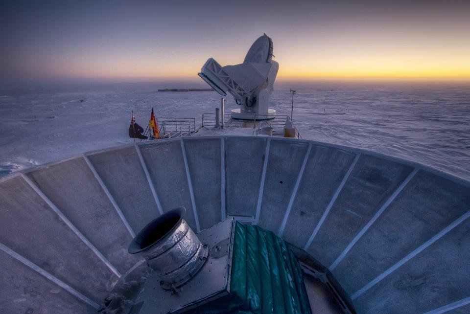 In this 2007 photo provided by Steffen Richter, the sun sets behind the BICEP2 telescope, foreground, and the South Pole Telescope in Antarctica. In the faint glowing remains of the Big Bang, scientists found "smoking gun" evidence that the universe began with a split-second of astonishingly rapid growth from a seed far smaller than an atom. To find a pattern of polarization in the faint light left over from the Big Bang, astronomers scanned about 2 percent of the sky for three years with the BICEP2 at the south pole, chosen for its very dry air to aid in the observations, said the leader of the collaboration, John Kovac of Harvard. (AP Photo/Steffen Richter)