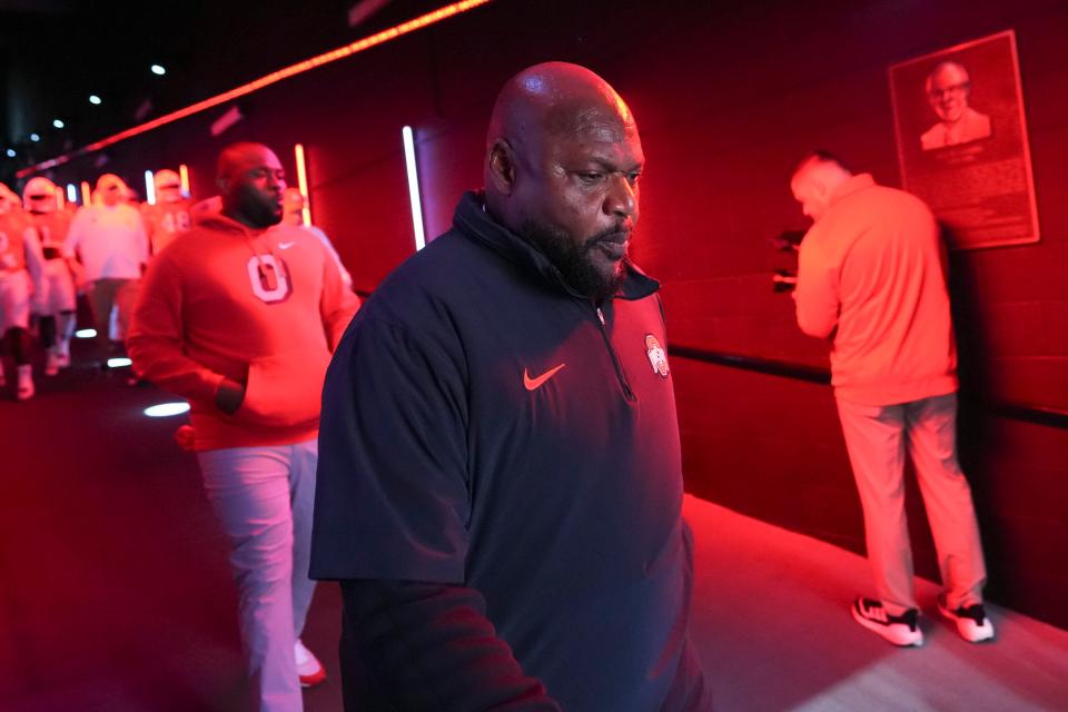 Nov 4, 2023; Piscataway, New Jersey, USA; Ohio State Buckeyes defensive line coach Larry Johnson walks to the field for warm-ups during the NCAA football game against the Rutgers Scarlet Knights at SHI Stadium. Ohio State won 35-16.