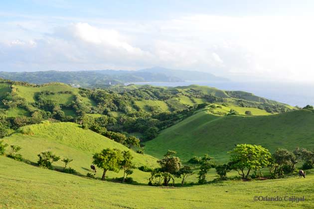 <strong>Batanes Islands.</strong> Isolated on the northernmost part of the country, the Batanes group of islands shows you nature at its best and life at its simplest. Desolate yet dramatic landscapes of verdant pasturelands, rolling hills and great turquoise seas, Batanes can help heal your tired, urban spirit. Or at the very least provide some incredible landscape photos to post in Facebook. (Photo by Orlando Cajigal)