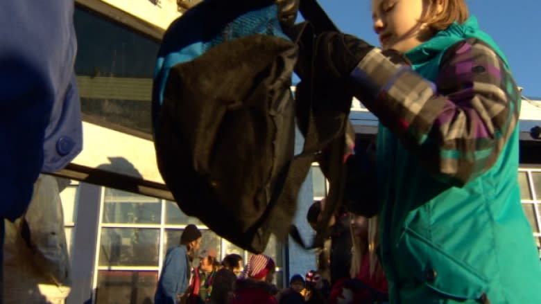 School kids deliver backpacks to the homeless
