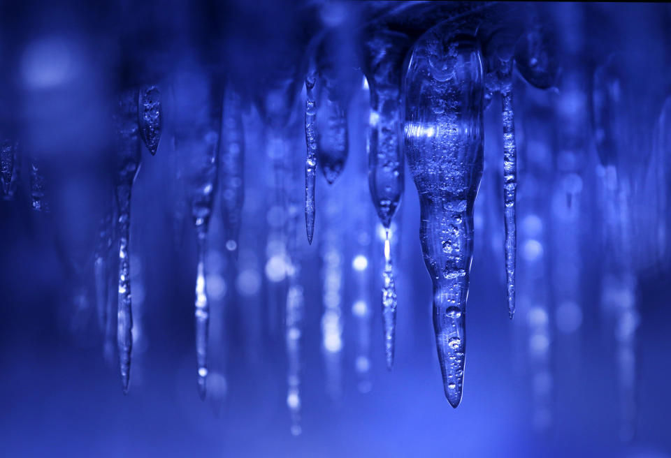 In this Feb. 2, 2014 photo, icicles hang from the ceiling of a cave at Apostle Islands National Lakeshore in northern Wisconsin, which has been transformed into a dazzling display of ice sculptures by the arctic siege gripping the Upper Midwest. The caves are usually are accessible only by water, but Lake Superior’s rock-solid ice cover is letting people walk to them for the first time since 2009. (AP Photo/The Star Tribune, Brian Peterson) MANDATORY CREDIT; ST. PAUL PIONEER PRESS OUT; MAGS OUT; TWIN CITIES TV OUT