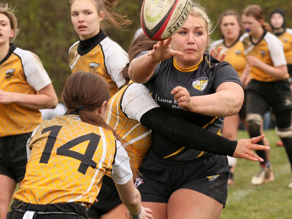 Makenna Swearingen passes the ball for Warrior Rugby during a 42-12 victory over Perrysburg on Sunday.
