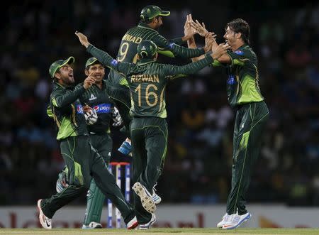 Pakistan's Anwar Ali (R) celebrates with his teammates Mukhtar Ahmed (9), Ahmed Shehzad (L) , Mohammad Rizwan (16) and Sarfraz Ahmed (2nd L) after taking the wicket of Sri Lanka's Tillakaratne Dilshan (not pictured) during their third One Day International cricket match in Colombo July 19, 2015. REUTERS/Dinuka Liyanawatte TPX IMAGES OF THE DAY