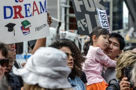 People participate in a protest in defense of the Deferred Action for Childhood Arrivals program or DACA in New York, U.S., September 9, 2017. REUTERS/Stephanie Keith/Files