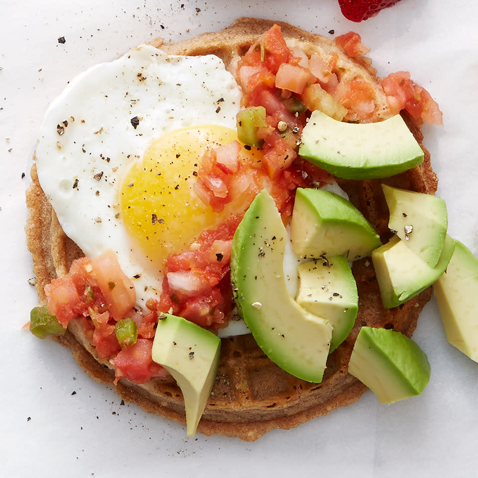 <p>This open-faced egg sandwich has a bit of southwestern flair with avocado and fresh salsa. And while you'd normally expect it served on toast or an English muffin, we've switched things up by serving it on a whole-grain waffle.</p> <p> <a href="https://www.eatingwell.com/recipe/269368/southwestern-waffle/" rel="nofollow noopener" target="_blank" data-ylk="slk:View Recipe" class="link ">View Recipe</a></p>