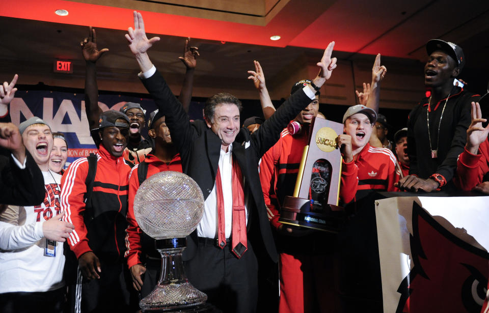 FILE - Louisville coach Rick Pitino and this team celebrate at the trophy ceremony after winning the NCAA Final Four tournament college basketball championship game against Michigan in Atlanta, in this Monday, April 8, 2013, file photo. Rick Pitino survived sex scandals and FBI investigations , won national championships , and when his coaching options seemingly dried up , he left for Greece. Somehow , the winding road of his career took him to Iona - and back in the NCAA Tournament. The last stop - he swears it’s true - of his career. (AP Photo/John Amis, File)