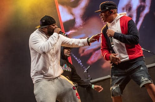 <span class="caption">Members of Wu-Tang Clan at Glastonbury 2019. The group took their name from the 1983 Kung Fu film Shaolin and Wu Tang</span> <span class="attribution"><a class="link " href="https://upload.wikimedia.org/wikipedia/commons/thumb/f/f0/Wu_Tang_Clan_West_Holts_Stage_Glastonbury_2019_007.jpg/2048px-Wu_Tang_Clan_West_Holts_Stage_Glastonbury_2019_007.jpg" rel="nofollow noopener" target="_blank" data-ylk="slk:Wikimedia;elm:context_link;itc:0;sec:content-canvas">Wikimedia</a>, <a class="link " href="http://creativecommons.org/licenses/by-sa/4.0/" rel="nofollow noopener" target="_blank" data-ylk="slk:CC BY-SA;elm:context_link;itc:0;sec:content-canvas">CC BY-SA</a></span>