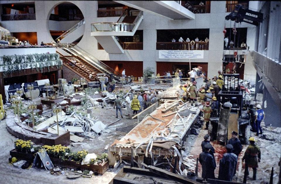 Kansas City firefighters were on the scene recovering victims hours after the initial collapse of the skywalks in the Hyatt Regency Hotel. File/The Kansas City Star