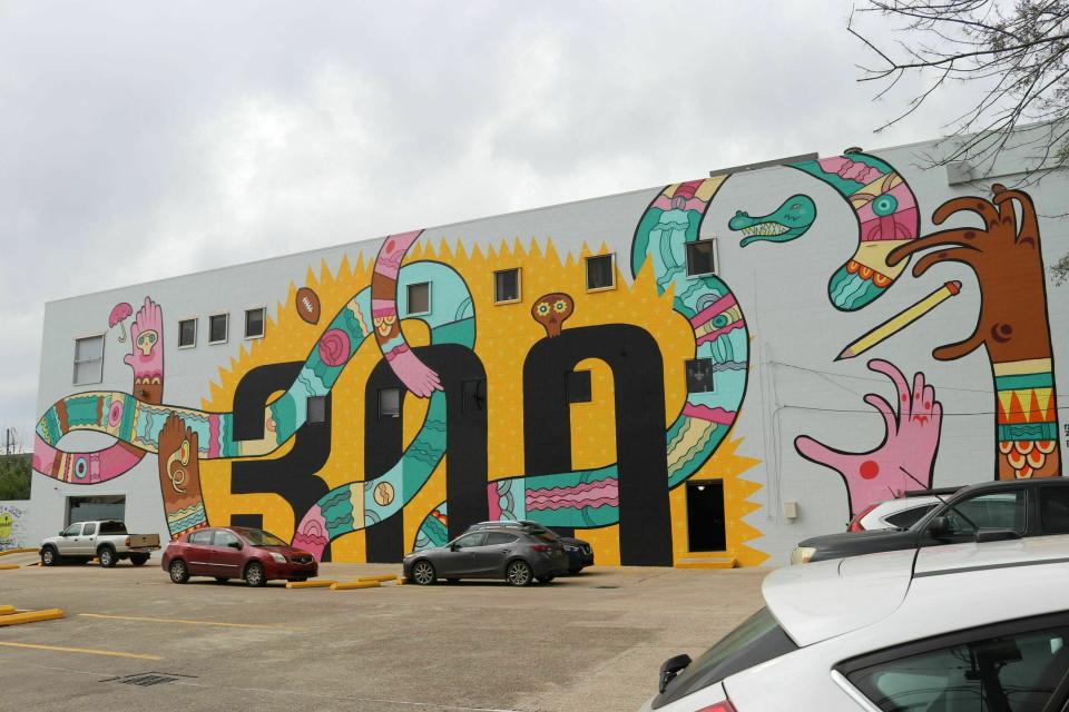 This mural celebrating New Orleans' tricentennial is among nearly two dozen created through Neal Morris's NOLA Murals Project after Morris sued New Orleans to overturn its murals regulations. A federal judge has scheduled a hearing for Tuesday, July 8, 2019 on whether New Orleans’ regulations for murals violate the free speech of a landowner whose wall painting features infamous Donald Trump quotes from a 2005 “Access Hollywood” recording.