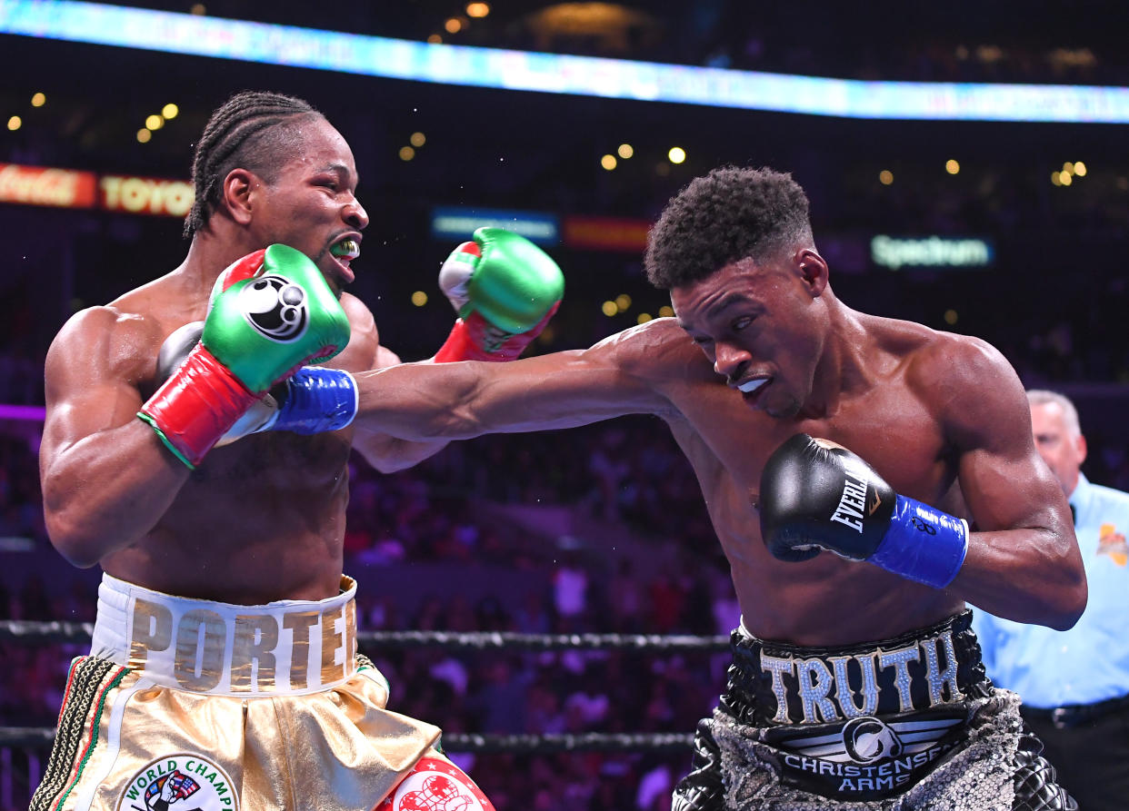 LOS ANGELES, CA - SEPTEMBER 28: Erroll Spence Jr (black/white trunks) and Shawn Porter (white/gold trunks) exchange punches during their IBF & WBC World Welterweight Championship fight at Staples Center on September 28, 2019 in Los Angeles, California. Spence, Jr won by decision. (Photo by Jayne Kamin-Oncea/Getty Images)