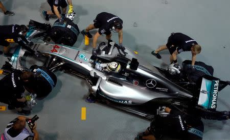 Formula One - Singapore Grand Prix - Marina Bay, Singapore - 16/9/16 The car of Mercedes' Lewis Hamilton of Britain is pushed back into the garage during second practice. REUTERS/Edgar Su