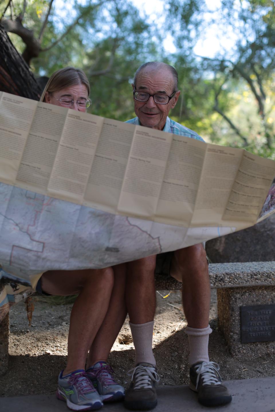 Carol Weston and Ron Richardson, both of Sun City, with a hiking map they got at Desert Horticultural Society of the Coachella Valley's 9th Annual Desert Garden Community Day at the Living Desert on Saturday, October 18, 2014.