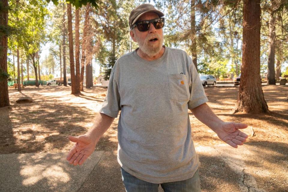 Jerry Burton, who lives on the northeast side of Paradise, describes his experience rebuilding his house at Bille Park in Paradise on Friday. Burton said he has lived in the area for more than two decades and was forced to construct a new home following the Camp Fire in 2018.
