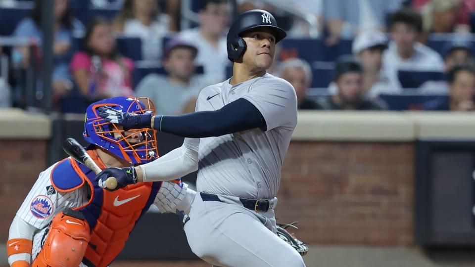 Jun 25, 2024; New York City, New York, USA; New York Yankees right fielder Juan Soto (22) follows through on a solo home run against the New York Mets during the fifth inning at Citi Field.