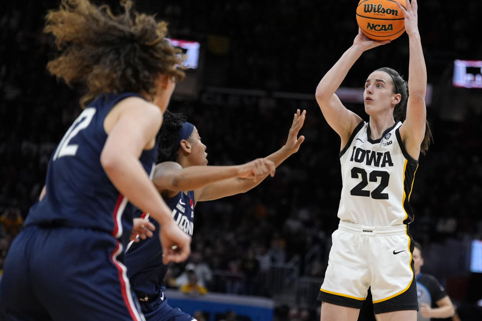 Iowa guard Caitlin Clark (22) shoots during the second half of a Final Four college basketball game against UConn in the women's NCAA Tournament, Friday, April 5, 2024, in Cleveland. (AP Photo/Morry Gash)