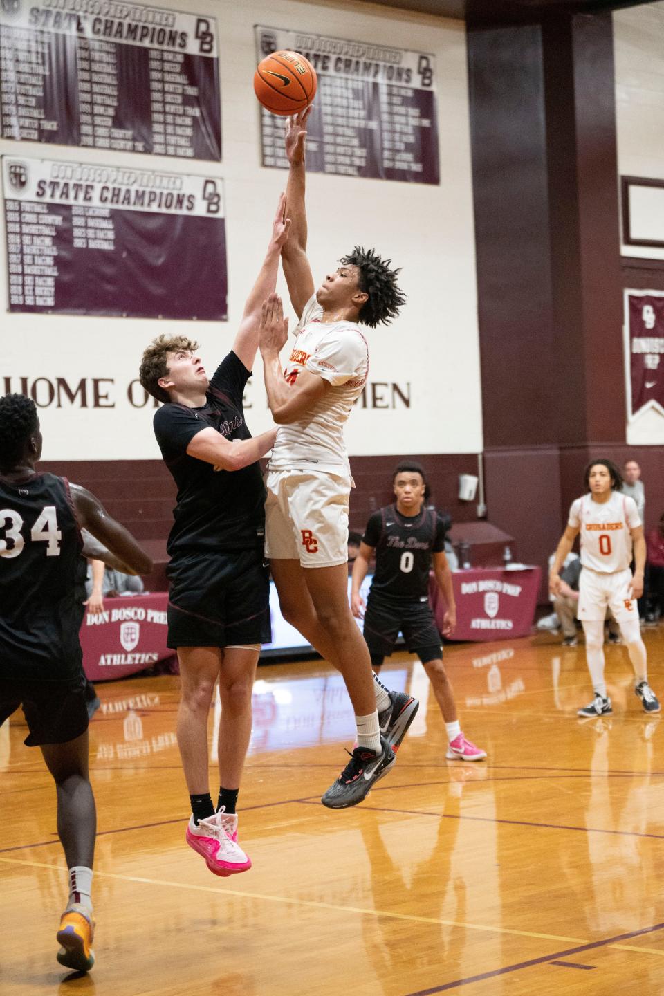 Jan 11, 2024; Ramsey, New Jersey, United States; Bergen Catholic boys basketball at Don Bosco. BC #24 Julius Avent takes a shot as DB #30 Brady Loughlin defends.