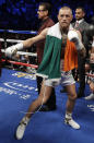 <p>Conor McGregor enters the ring before a super welterweight boxing match against Floyd Mayweather Jr., Saturday, Aug. 26, 2017, in Las Vegas. (AP Photo/Isaac Brekken) </p>