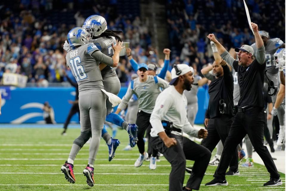 The Detroit Lions celebrate their first win of the NFL season after beating the Minnesota Vikings in the last few seconds (Paul Sancya/AP) (AP)