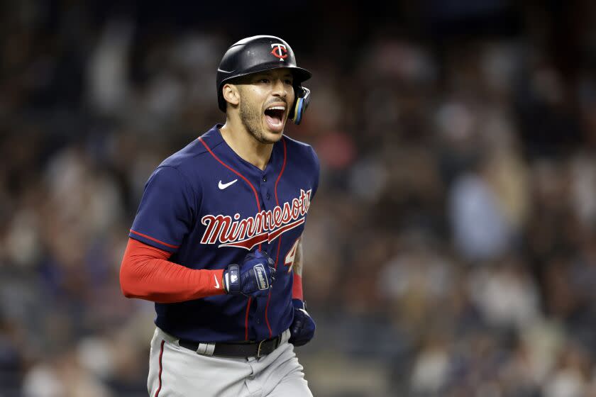 Minnesota Twins' Carlos Correa reacts after hitting a two-run home run