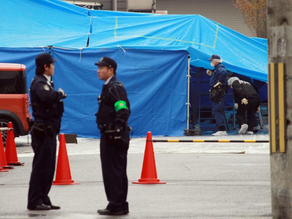 <div class="inline-image__title">457770479</div> <div class="inline-image__caption"><p>Police officers inspect the murder site of Takayuki Ohigashi in Kyoto, western Japan. </p></div> <div class="inline-image__credit">Jiji Press/AFP via Getty</div>