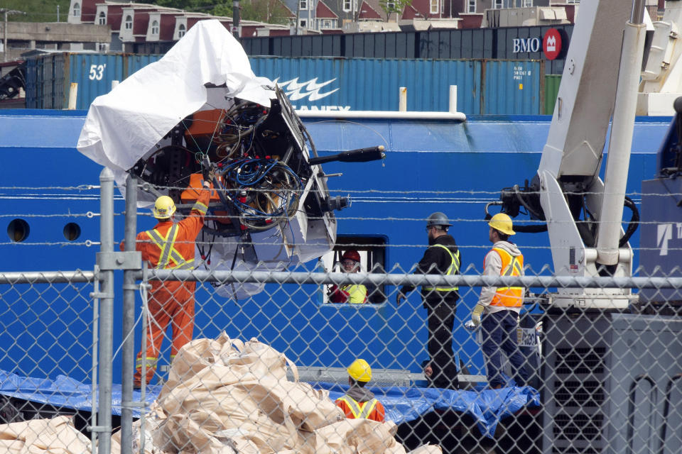 FILE - Debris from the Titan submersible, recovered from the ocean floor near the wreck of the Titanic, is unloaded from the ship Horizon Arctic at the Canadian Coast Guard pier in St. John's, Newfoundland, June 28, 2023. (Paul Daly/The Canadian Press via AP, File)