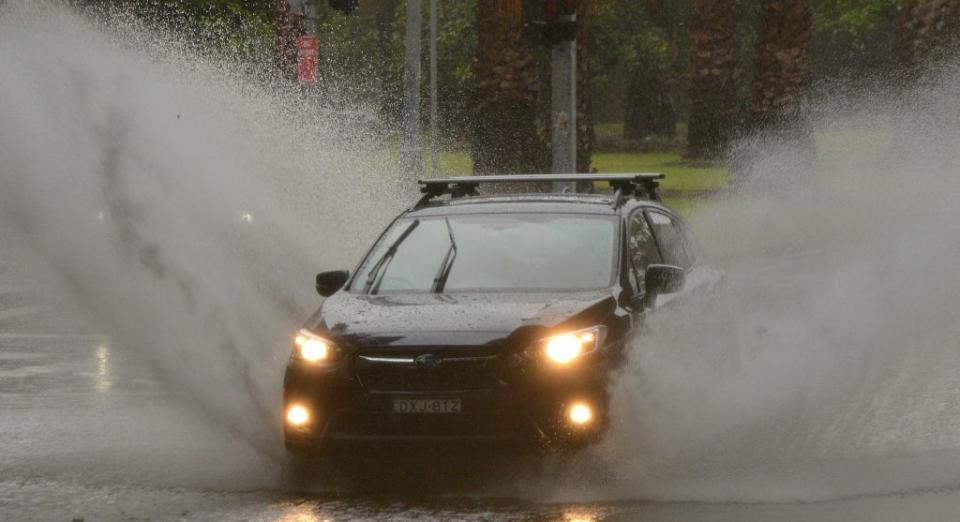 A car makes a splash on a Sydney road