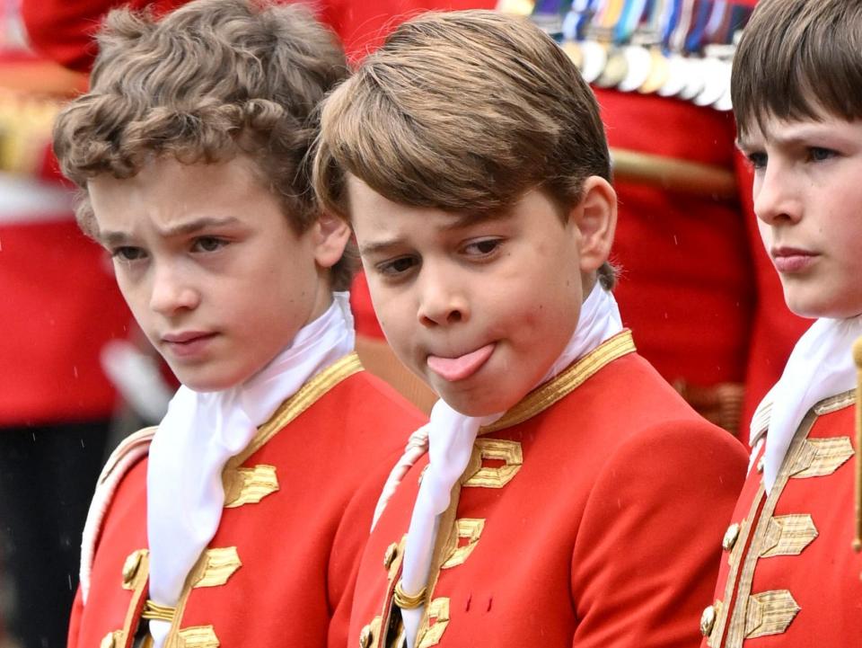 Britain's Prince George of Wales (C) stands at Westminster Abbey in central London on May 6, 2023, ahead of the coronation