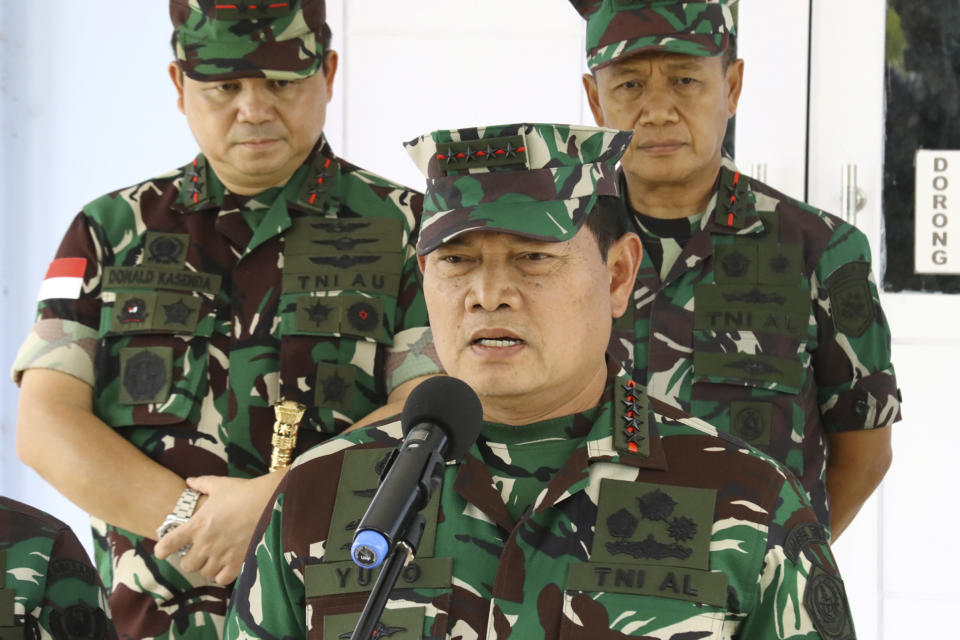 Indonesian Armed Forces Chief Adm. Yudo Margono, center, speaks to the media during a press conference in Mimika, Papua province, Indonesia, Tuesday, April 18, 2023. Indonesia's military chief on Tuesday dismissed a separatist group claim that they had killed more than a dozen government soldiers who were searching for a New Zealand pilot taken hostage by the rebels in the restive Papua region. (AP Photo/Saldi Hermanto)