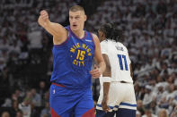 Denver Nuggets center Nikola Jokic (15) gestures during the first half of Game 3 of an NBA basketball second-round playoff series against the Minnesota Timberwolves, Friday, May 10, 2024, in Minneapolis. (AP Photo/Abbie Parr)