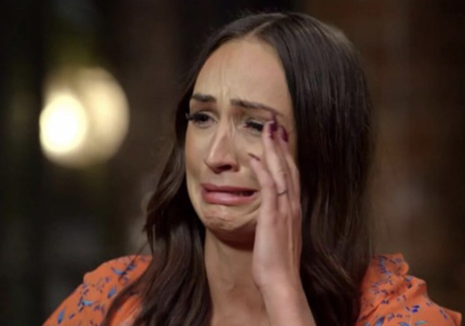 MAFS Hayley Vernon wearing an orange top crying