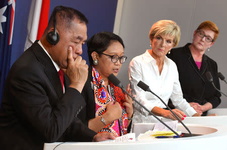 Indonesia's Defence Minister Ryamizard Ryacudu and Foreign Minister Retno Marsudi stand with Australia's Foreign Minister Julie Bishop and Defence Minister Marise Payne during a media conference after their bilateral meeting in Sydney, Australia, March 16, 2018. William West/Pool via REUTERS