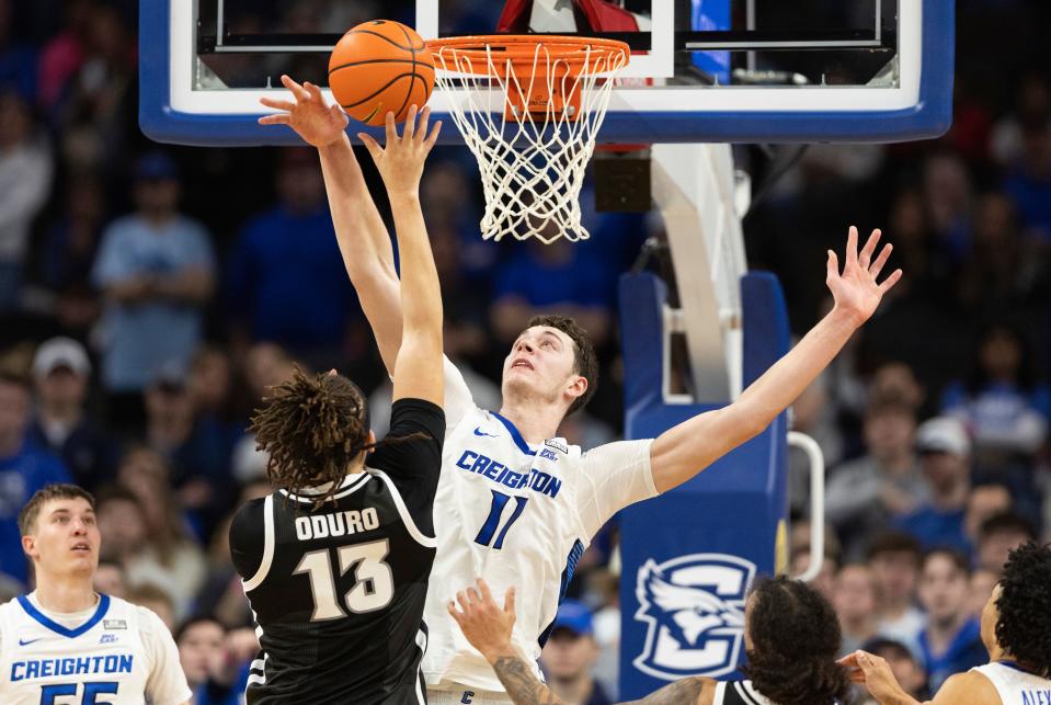 Creighton's Ryan Kalkbrenner (11) blocks a shot by Providence's Josh Oduro during the second half of Saturday's game.