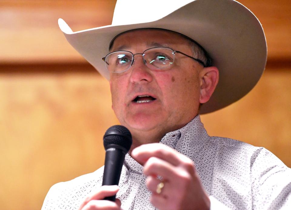 Taylor County Sheriff Ricky Bishop answers a question posed by members of his department during a debate between him and two other candidates Friday.