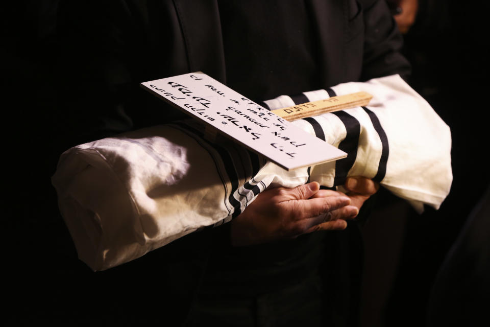 A man holds a baby who died after being prematurely delivered after her mother Shira Ish-Ran was wounded in a shooting attack near Ofra settlement in the West Bank last Sunday, in Jerusalem, Wednesday, Dec. 12, 2018. (AP Photo/Heidi Levine)