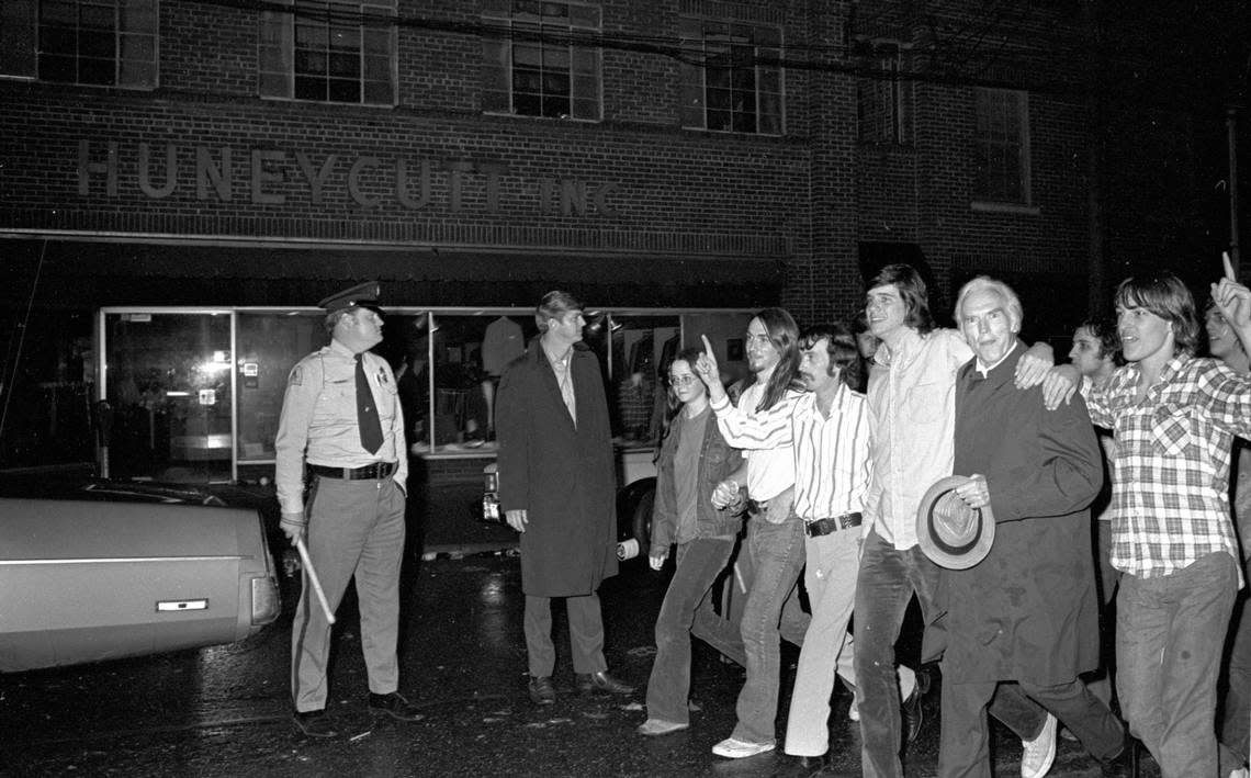 NC State fans march down Hillsborough Street following the Wolfpack’s 1974 national championship win. NC State chancellor John Caldwell (carrying hat) joined the crowd for their march and celebration.